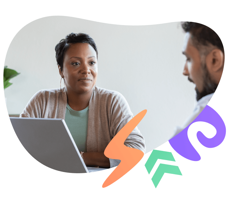 Young man and woman having a conversation in front of a laptop