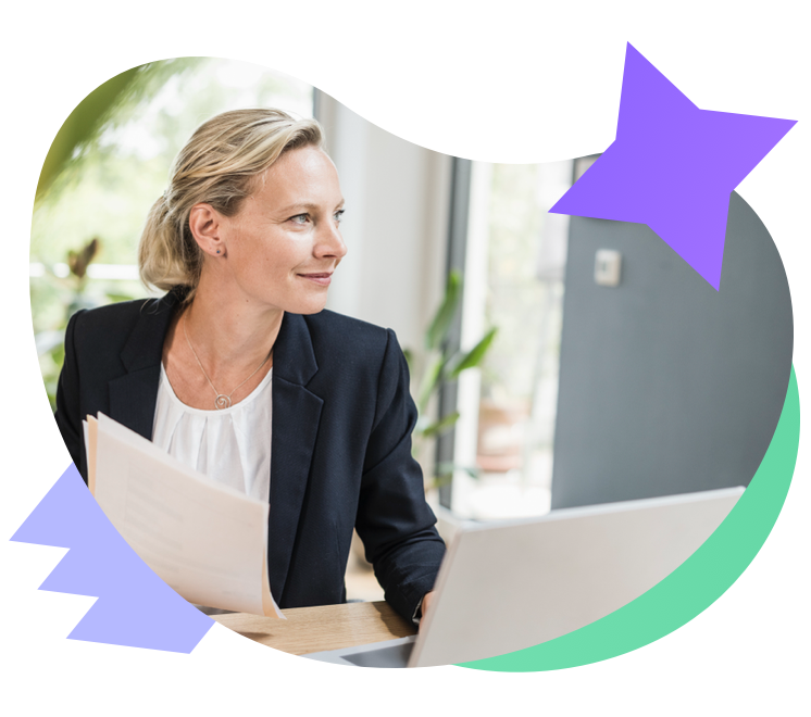 Businesswoman sitting at a desk with papers