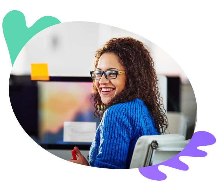 Young businesswoman smiling at her desk