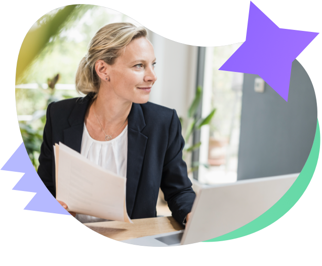 Businesswoman sitting at a desk with papers